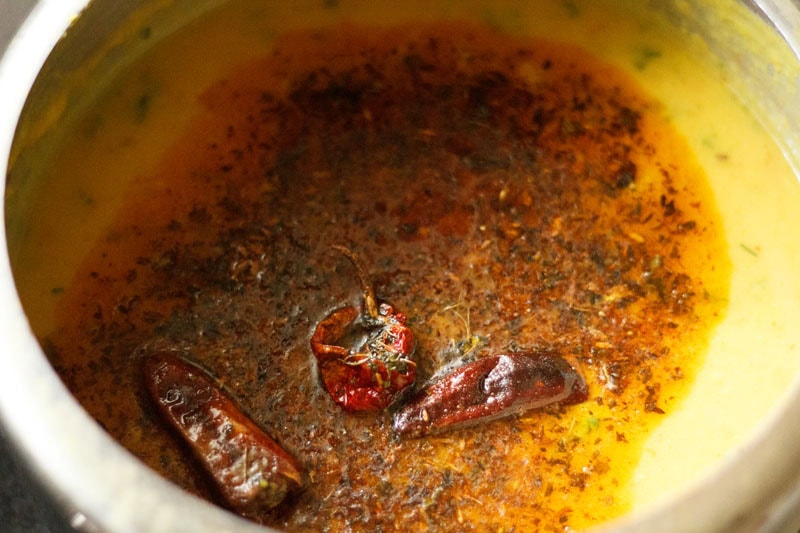 tempering mixture with oil added to the cooked dal.