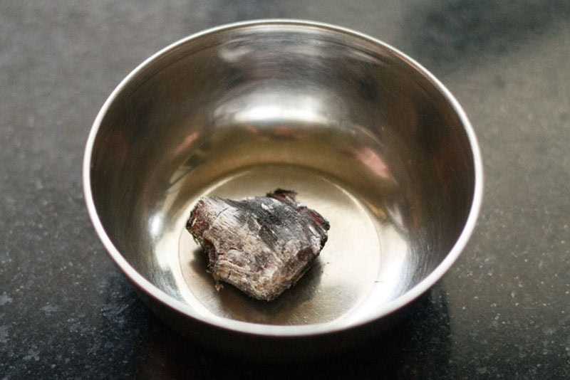 red hot charcoal kept in a small steel bowl.