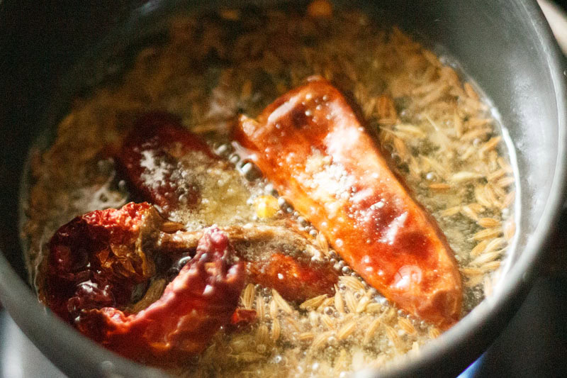 dry fenugreek leaves and red chilli powder added in the tadka pan.