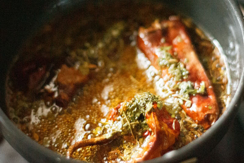 dry red chillies, finely chopped garlic and asafoetida (hing) added in the tadka pan.