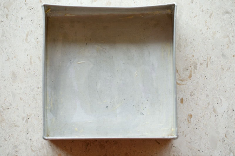 baking pan greased with oil for making eggless brownie. 