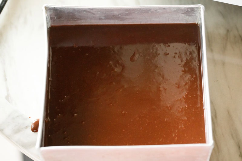 brownie batter in a cake tin.